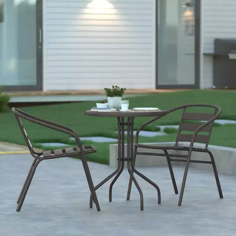 Emma and Oliver 23.75'' Round Glass Top Metal Table with 2 Aluminum Slat Stack Chairs